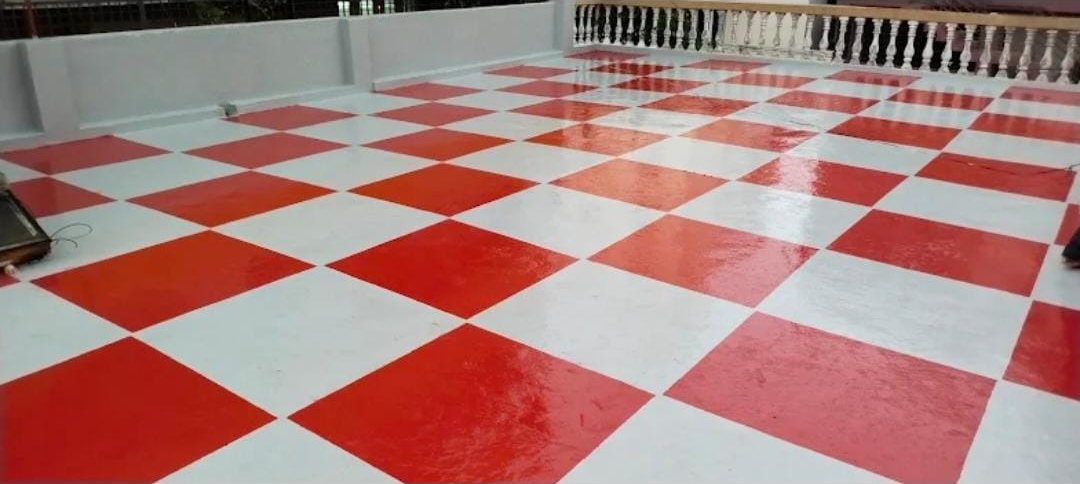 Red and white epoxy design finish on a terrace in Bangalore